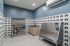 Modern pet grooming station with stylish tiles and top-notch stainless steel facilities, perfect for premium pet care.