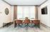 Furnished meeting area with table and chairs