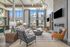 furnished clubroom with seating, high ceilings and television