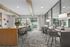 furnished clubroom area with tables and chairs