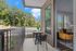furnished patio area of apartment home on sunny day