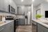 furnished kitchen with island in apartment home