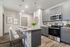 furnished kitchen with island in apartment home
