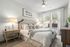 Pet-Friendly Apartments In Birmingham - Tributary Rise - Spacious Bedroom With Plush Carpeting, Ceiling Fan, And Windows With Blinds.