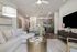 furnished living and kitchen area in apartment