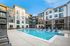 Birmingham, AL Apartments - Tributary Rise - Resort-Style Saltwater Pool In The Heart Of The Apartment Community. Pool Area Has Lounge Chairs And Tables.