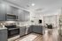 Furnished kitchen with view of living room