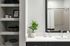 Chic bathroom vanity with sleek countertop, stylish shelving, and modern accents for a serene, inviting atmosphere.
