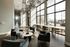 Bright, modern lobby with plush seating, elegant decor, and floor-to-ceiling windows offering abundant natural light.