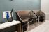 Modern apartment amenity featuring a sleek pet washing station with stainless steel basins and stylish hexagonal tiles.