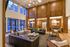 Luxurious lobby with high wooden ceilings, stylish modern furniture, and large windows for natural light.
