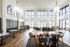 Bright, spacious living area with elegant high ceilings, featuring modern lighting and large windows overlooking scenic views.