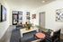 Elegant and inviting lounge area featuring modern art, comfortable seating, and abundant natural light.