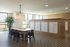 Chic and modern communal area with elegant patterned floor tiles, stylish pendant lighting, and ample mailbox storage.