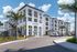 Modern apartment complex with sleek architecture, palm trees, and a spacious parking area under a clear blue sky.