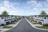 Charming townhouse community featuring modern two-story homes with garages, palm-lined streets, and a serene atmosphere under a clear blue sky.