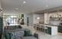 Modern lobby lounge with elegant seating area, stylish bar counter, and lush green accents, evoking warmth and sophistication.