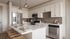 Modern kitchen with sleek stainless steel appliances, elegant marble countertops, and stylish lighting fixtures, perfect for gourmet cooking.