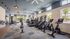 Modern fitness center featuring state-of-the-art equipment, bright natural lighting, and stylish design.