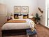 Large bedroom with oversized windows, cozy carpeting
