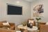 Cozy living area with elegant leather armchairs, abstract art, and chic decor, perfect for relaxation.