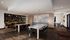 Modern dining space featuring elegant marble tables, contemporary lighting, and artistic wall designs, ideal for stylish gatherings.