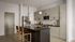 Modern kitchen with sleek cabinetry, a large island, and elegant pendant lighting, perfect for culinary creativity.