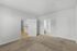 Bright, modern bedroom with plush carpet, en-suite bathroom, and open access to living area.