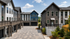 Modern townhouse complex with stylish architecture, featuring sleek exteriors, large windows, and serene surroundings.