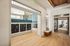 Inviting apartment lobby with stylish mailboxes, light wood flooring, and elegant seating area.