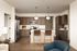 Modern kitchen with stylish pendant lighting, sleek stainless steel appliances, and a spacious island with seating for two.