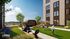 Elegant rooftop garden with modern seating, lush greenery, and people enjoying a game of mini-golf under a clear sky.