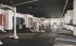 Modern fitness center featuring state-of-the-art gym equipment, sleek design, and ample natural lighting.