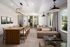 Elegant open-concept living and dining area with modern seating, chic lighting fixtures, and expansive windows inviting natural light.