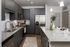 Modern kitchen with sleek dark cabinetry, stainless steel appliances, and elegant granite countertops.