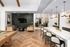 Chic apartment interior featuring a modern open-concept living area with a sleek TV setup, cozy seating, stylish wood-pattern flooring, and a contemporary kitchen island with elegant pendant lighting.