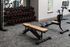 Modern fitness center with sleek weight bench, comprehensive dumbbell rack, and state-of-the-art exercise bikes set against a stylish interior.