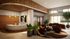 Luxurious apartment lobby with elegant curved reception desk, stylish lighting, and plush seating area adorned with vibrant artwork and lush greenery.