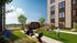 Luxurious apartment outdoor area featuring vibrant landscaping, seating, and recreation space with people enjoying leisure activities under a clear blue sky.
