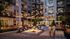 Chic apartment courtyard with inviting fire pit, cozy seating, and ambient string lights, ideal for social gatherings.