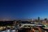 Breathtaking cityscape view featuring a vibrant skyline illuminated under a twilight sky.