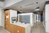 Modern mailroom with sleek mailboxes, contemporary lighting, and stylish decor, highlighting a welcoming and functional space.