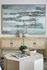 Elegant living room with chic abstract wall art, decorative vases, and a modern, stylish beige console table. Features a unique geometric coffee table adorned with a plant and decorations, creating a serene and inviting ambiance.