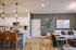 Contemporary open-plan living area with a stylish kitchen, cozy seating, and elegant decor, perfect for relaxation and entertaining.