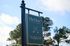 Inviting sign for The View at Crow Creek in picturesque Calabash, NC, set against a serene backdrop of trees and blue sky.