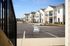 Charming modern apartment complex with spacious balconies and pristine landscaping, offering a welcoming community vibe.