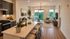 Modern open-plan living room with a chic kitchen island and stunning views, perfect for relaxation and entertaining.