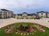 Charming apartment complex with modern architecture, lush landscaped gardens, and inviting communal areas.