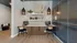 Modern office space with contemporary design featuring dual computer stations and chic decor on open shelving.