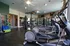 Modern fitness center with state-of-the-art cardio machines, strength equipment, and vibrant exercise accessories.